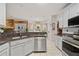 Stylish kitchen featuring granite countertops, stainless steel appliances, and white cabinetry at 21 Cass Station Pass Nw Pass, Cartersville, GA 30121