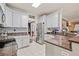 Modern kitchen with stainless steel appliances, granite countertops, and white cabinetry at 21 Cass Station Pass Nw Pass, Cartersville, GA 30121