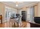 Well-lit home office with hardwood floors, a computer setup, and French doors leading to the dining room at 21 Cass Station Pass Nw Pass, Cartersville, GA 30121