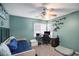 Cozy bedroom with ceiling fan, desk, and shelving at 3214 Country Walk Dr, Powder Springs, GA 30127