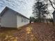 View of the backyard, featuring grass and several trees at 40 Brandon Dr, Covington, GA 30016