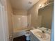 Bathroom featuring a combined tub and shower, toilet, sink and a mirror at 40 Brandon Dr, Covington, GA 30016