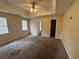 Primary bedroom featuring plush carpet, neutral walls and natural light at 40 Brandon Dr, Covington, GA 30016