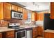 Modern kitchen with stainless steel appliances, granite countertops and wooden cabinets at 562 Formwalt Sw St # 5, Atlanta, GA 30312