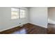 Cozy bedroom with natural light, hardwood floors, and neutral paint creating a serene space at 1722 Detroit Nw Ave, Atlanta, GA 30314