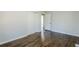 Bedroom with hardwood floors, closet, and neutral paint at 1722 Detroit Nw Ave, Atlanta, GA 30314