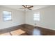 Bedroom with hardwood floors, ceiling fan, and natural light from two windows at 1722 Detroit Nw Ave, Atlanta, GA 30314