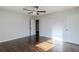 Bedroom with hardwood floors, ceiling fan and sliding closet at 1722 Detroit Nw Ave, Atlanta, GA 30314
