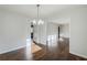 Dining room features modern chandelier, hardwood floors, and an open layout perfect for entertaining at 1722 Detroit Nw Ave, Atlanta, GA 30314