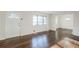 Bright living room featuring hardwood floors, neutral walls, and a large window for ample natural light at 1722 Detroit Nw Ave, Atlanta, GA 30314