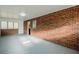 Bright sunroom with brick accents and an array of windows offering plenty of sunlight and indoor-outdoor living at 1722 Detroit Nw Ave, Atlanta, GA 30314