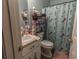 Small bathroom featuring a mermaid-themed shower curtain and vanity at 42 Windrush Dr, White, GA 30184