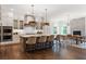 Open kitchen features a large kitchen island, breakfast bar, stainless steel appliances and herringbone backsplash at 4976 Concert Ln, Marietta, GA 30066