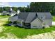 An aerial perspective of the home shows its exterior, backyard, and layout, emphasizing its expansive size at 1291 Pleasant Grove Church Rd, Villa Rica, GA 30180