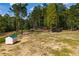 The vast backyard provides ample space for outdoor recreation and relaxation, complemented by lush greenery at 1291 Pleasant Grove Church Rd, Villa Rica, GA 30180