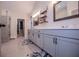 Modern bathroom with double vanity, sleek fixtures, and walk-in closet access at 1291 Pleasant Grove Church Rd, Villa Rica, GA 30180