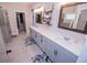 Modern bathroom with double vanity, sleek fixtures, and walk-in closet access at 1291 Pleasant Grove Church Rd, Villa Rica, GA 30180