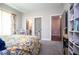 Bedroom featuring a white iron bed frame and two doorways at 1291 Pleasant Grove Church Rd, Villa Rica, GA 30180