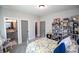 Bedroom with a white iron bed frame and bookshelf at 1291 Pleasant Grove Church Rd, Villa Rica, GA 30180
