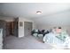 This is a well-lit carpeted bedroom featuring an eye-catching color palette and comfortable furnishing at 1291 Pleasant Grove Church Rd, Villa Rica, GA 30180