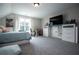 A cozy bedroom with a large window and built-in storage, offering a comfortable and functional living space at 1291 Pleasant Grove Church Rd, Villa Rica, GA 30180