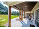 A view of the covered porch with wooden pillars, offering a serene outdoor living space at 1291 Pleasant Grove Church Rd, Villa Rica, GA 30180