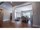 Spacious dining room with chandelier lighting, neutral tones, and wood flooring at 1291 Pleasant Grove Church Rd, Villa Rica, GA 30180