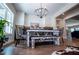 Charming dining room features a modern chandelier and a rustic farmhouse-style table at 1291 Pleasant Grove Church Rd, Villa Rica, GA 30180