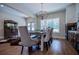 Charming dining room with stylish chandelier and comfortable seating for memorable meals at 1291 Pleasant Grove Church Rd, Villa Rica, GA 30180
