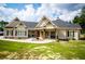Charming single-story home featuring a covered front porch with wooden columns and a well-manicured lawn at 1291 Pleasant Grove Church Rd, Villa Rica, GA 30180