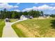The home's exterior is beautifully complemented by the surrounding landscape, enhancing its curb appeal at 1291 Pleasant Grove Church Rd, Villa Rica, GA 30180