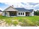 Back of house, showing the covered patio and siding at 1291 Pleasant Grove Church Rd, Villa Rica, GA 30180
