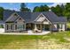 Charming one-story home featuring a welcoming front porch and well-manicured lawn at 1291 Pleasant Grove Church Rd, Villa Rica, GA 30180