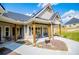 Inviting covered front porch featuring a cozy seating area with comfortable chairs and table at 1291 Pleasant Grove Church Rd, Villa Rica, GA 30180