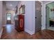 Inviting hallway features a decorative cabinet, leading to other areas of the home at 1291 Pleasant Grove Church Rd, Villa Rica, GA 30180