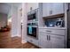 Modern kitchen features stainless steel appliances, gray cabinetry, and backsplash at 1291 Pleasant Grove Church Rd, Villa Rica, GA 30180