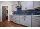 Stylish kitchen with gray cabinetry, stainless steel appliances, and a modern backsplash at 1291 Pleasant Grove Church Rd, Villa Rica, GA 30180
