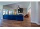 Open-concept living room with stone fireplace, vaulted ceilings, and lots of natural light at 1291 Pleasant Grove Church Rd, Villa Rica, GA 30180