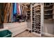 Walk-in closet with white built-ins, ample storage, and organization for clothes and shoes at 1291 Pleasant Grove Church Rd, Villa Rica, GA 30180