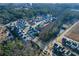 Aerial view of a neighborhood showcasing modern homes, landscaping, and trees at 140 Kingsley Way, Acworth, GA 30102
