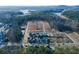 An aerial view showcases new homes and community development by the lake at 140 Kingsley Way, Acworth, GA 30102
