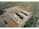 Aerial view of new homes under construction in a community surrounded by lush trees at 140 Kingsley Way, Acworth, GA 30102