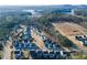 Aerial view of a new neighborhood featuring craftsman-style homes by the lake at 140 Kingsley Way, Acworth, GA 30102