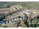 Aerial view of homes in a new construction community near a wooded area at 140 Kingsley Way, Acworth, GA 30102