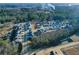 Aerial view of a community featuring modern homes with well-kept lawns, enhanced by mature trees at 140 Kingsley Way, Acworth, GA 30102