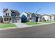 Street view of modern two-story homes with attached garages and sidewalks at 140 Kingsley Way, Acworth, GA 30102