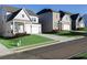 Neighborhood street featuring modern homes with manicured lawns and stylish exteriors at 140 Kingsley Way, Acworth, GA 30102