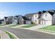 Street view showcasing a row of newly constructed homes with well-kept lawns at 140 Kingsley Way, Acworth, GA 30102