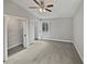 Cozy bedroom with a large walk-in closet and plush gray carpet at 332 Hickory Acres Se Dr, Smyrna, GA 30082