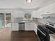 Updated kitchen with stainless steel appliances and sliding glass door access to a deck at 332 Hickory Acres Se Dr, Smyrna, GA 30082